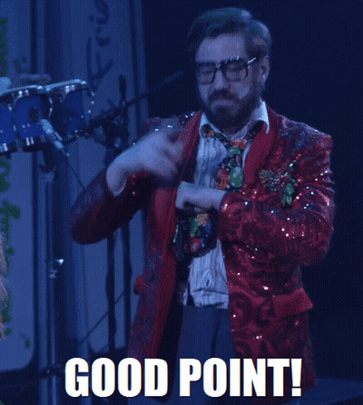 A Man In A Red Sequined Suit And Tie Says Good Point In White Letters GIF