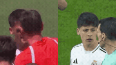 A Man In A Red Shirt And A Man In A White Adidas Shirt Are Standing Next To Each Other On A Field . GIF
