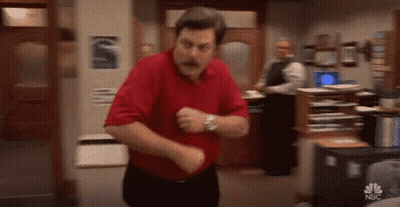 A Man In A Red Shirt And Black Pants Is Dancing In A Room . GIF