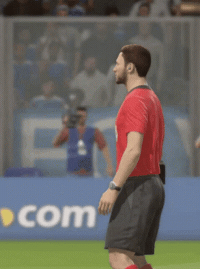 A Man In A Red Shirt And Black Shorts Is Standing On A Field GIF
