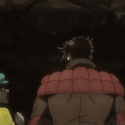 A Man In A Red Shirt And Tie Is Standing Next To Another Man In A Green Hat GIF