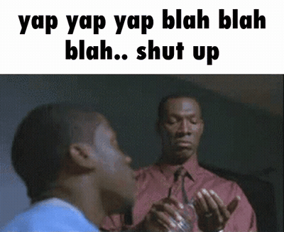 A Man In A Red Shirt And Tie Is Talking To Another Man GIF