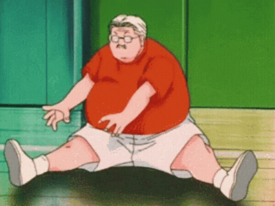 A Man In A Red Shirt And White Shorts Sits On A Black Object GIF