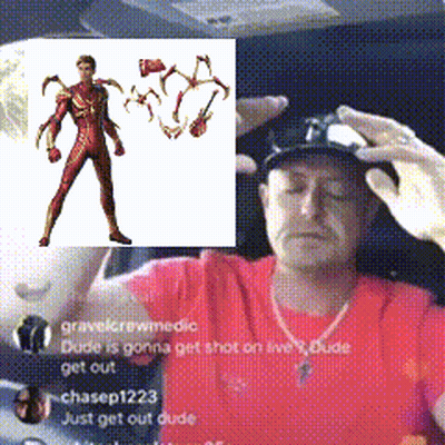 A Man In A Red Shirt Has A Picture Of A Man In A Red Suit Behind Him That Says Dude Is Gonna Get Shot GIF