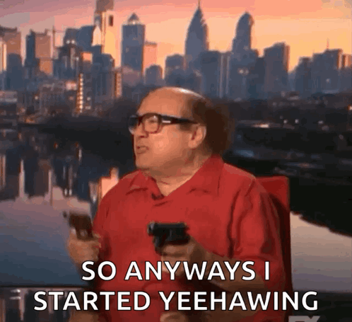 A Man In A Red Shirt Holding A Gun Says So Anyways I Started Yeehawing GIF