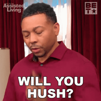 A Man In A Red Shirt Is Asking If Someone Will Hush GIF