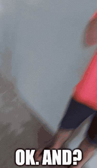 A Man In A Red Shirt Is Covering His Mouth With His Hand And Says Ok And GIF