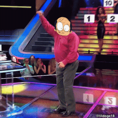 A Man In A Red Shirt Is Dancing On A Stage In Front Of A Crowd With A Sign That Says 1 On It GIF