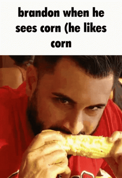 A Man In A Red Shirt Is Eating Corn With The Caption Brandon When He Sees Corn ( He Likes Corn ) GIF