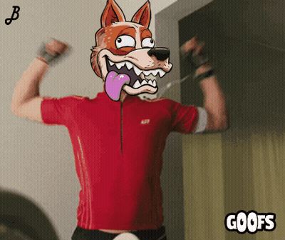 A Man In A Red Shirt Is Flexing His Muscles With A Cartoon Fox On His Head And The Words Goofs Below Him GIF