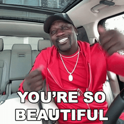 A Man In A Red Shirt Is Giving A Thumbs Up With The Words You 'Re So Beautiful Underneath Him GIF