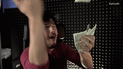A Man In A Red Shirt Is Holding A Bunch Of Money In His Hands GIF