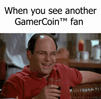 A Man In A Red Shirt Is Holding A Glass Of Wine And Smiling GIF