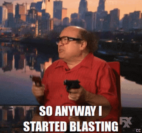 A Man In A Red Shirt Is Holding A Gun With The Words So Anyway I Started Blasting GIF