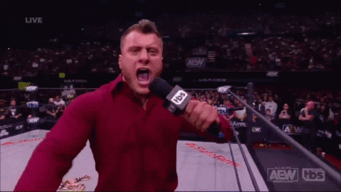 A Man In A Red Shirt Is Holding A Microphone And Says I Am The Best GIF