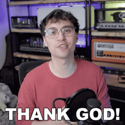 A Man In A Red Shirt Is Holding A Microphone And Says Thank God GIF