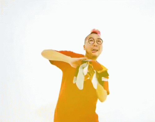 A Man In A Red Shirt Is Holding A Pair Of Socks And The Words You And Me Are Above Him GIF