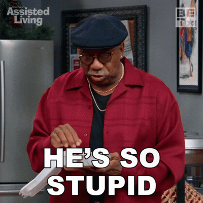 A Man In A Red Shirt Is Holding A Piece Of Paper And Says He 'S So Stupid GIF