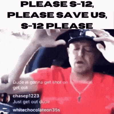A Man In A Red Shirt Is Holding His Head And Asking For Help GIF
