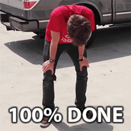 A Man In A Red Shirt Is Kneeling In Front Of A Truck That Says 100 % Done On The Ground GIF