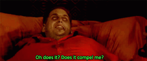 A Man In A Red Shirt Is Laying In Bed With The Words Oh Does It Does It Compel Me Written Below Him GIF
