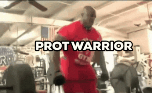 A Man In A Red Shirt Is Lifting Weights In A Gym With The Words Protwarrior Above Him GIF