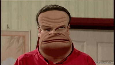 A Man In A Red Shirt Is Making A Funny Face And The Website Gifrun.com Is Visible In The Corner GIF