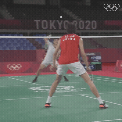 A Man In A Red Shirt Is Playing Badminton In Tokyo 2020 GIF