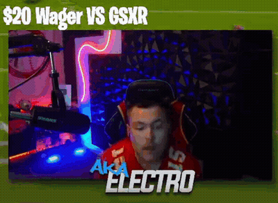 A Man In A Red Shirt Is Sitting In Front Of A Microphone With The Words Wager Vs Gsxr Above Him . GIF