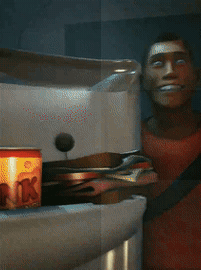 A Man In A Red Shirt Is Smiling In Front Of A Fridge GIF