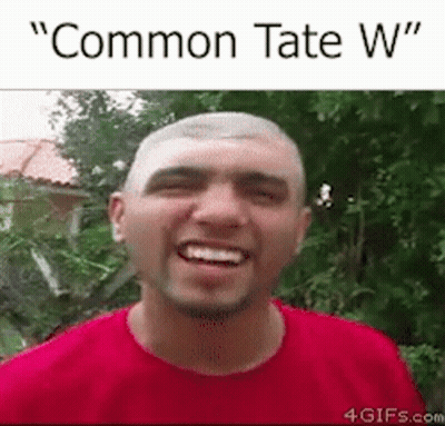 A Man In A Red Shirt Is Smiling With The Words `` Common Tate W '' Written Above Him . GIF
