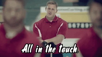 A Man In A Red Shirt Is Standing In Front Of A Group Of Men And Says All In The Touch GIF
