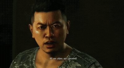 A Man In A Red Shirt Is Standing Next To Another Man In A Black Shirt GIF