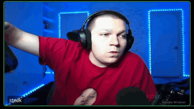 A Man In A Red Shirt Is Wearing Headphones And A Microphone . GIF