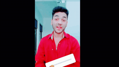 A Man In A Red Shirt Making A Funny Face GIF