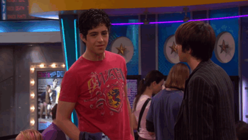 A Man In A Red Shirt Says " I 'M Done With You " To Another Man GIF