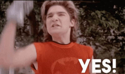 A Man In A Red Shirt Says Yes In White Letters GIF