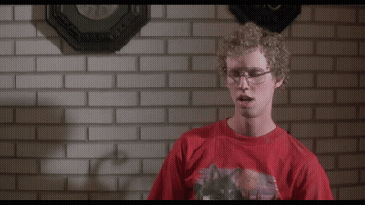 A Man In A Red Shirt Stands In Front Of A Brick Wall And Says " Heck Yes I Did " GIF