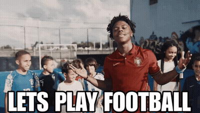 A Man In A Red Shirt Stands In Front Of A Group Of Children With The Words Let 'S Play Football Above Him GIF
