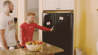 A Man In A Red Shirt That Says Hundred On The Sleeve GIF