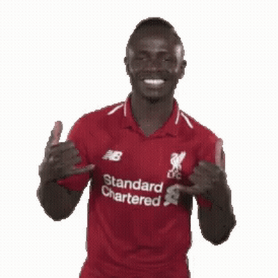 A Man In A Red Shirt That Says Standard Chartered On It GIF