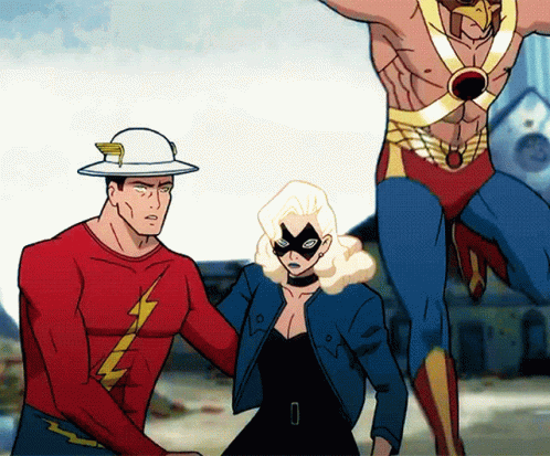 A Man In A Red Shirt With A Lightning Bolt On It Stands Next To A Woman In A Mask GIF