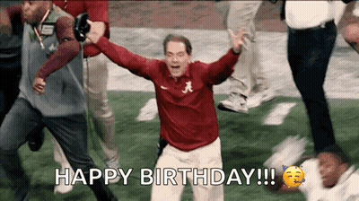 A Man In A Red Shirt With The Letter A On It Celebrates On A Football Field . GIF
