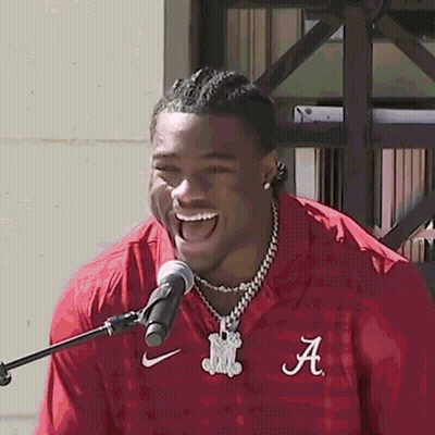 A Man In A Red Shirt With The Letter A On It GIF
