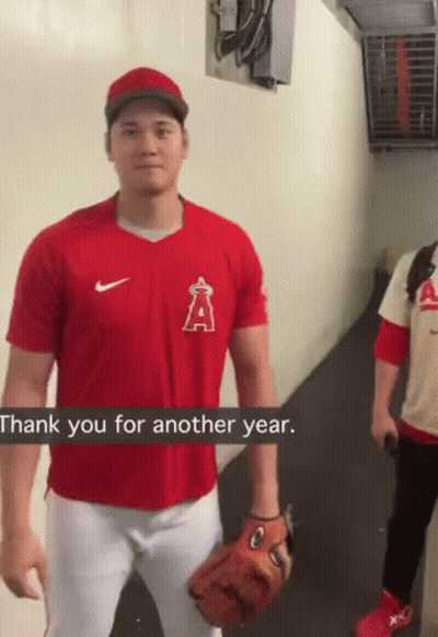 A Man In A Red Shirt With The Letter A On The Front GIF