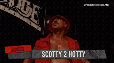 A Man In A Red Shirt With The Name Scotty 2 Hotty On A Sign GIF