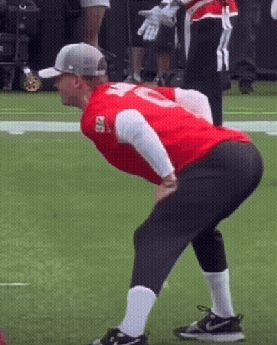 A Man In A Red Shirt With The Number 10 On It GIF