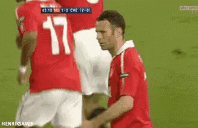 A Man In A Red Shirt With The Number 17 On His Back GIF
