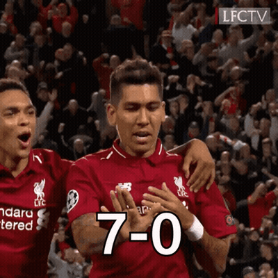 A Man In A Red Shirt With The Number 7 On His Chest GIF