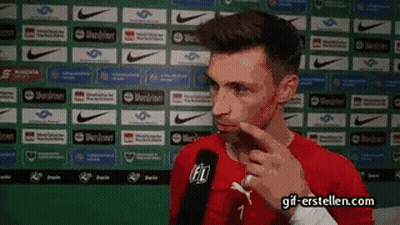 A Man In A Red Shirt With The Number 7 On It GIF